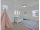 Charming bedroom with twin beds, a teepee, and plenty of natural light at 10564 Royal Cypress Way, Orlando, FL 32836