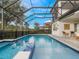 Stunning pool and spa with a covered patio, ideal for outdoor entertaining at 10564 Royal Cypress Way, Orlando, FL 32836