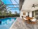 Enjoy the refreshing pool and spa with a covered patio and lush landscaping at 10564 Royal Cypress Way, Orlando, FL 32836