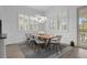 Bright breakfast nook with wood table and pool view at 10564 Royal Cypress Way, Orlando, FL 32836