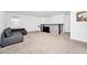 Loft with gray sectional sofa and TV at 11648 Paragraph Rd, Orlando, FL 32832