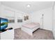 Well-lit bedroom with a TV, double bed and window coverings at 11648 Paragraph Rd, Orlando, FL 32832