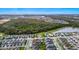 Aerial view of property and surrounding houses and green areas at 11648 Paragraph Rd, Orlando, FL 32832