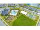 Aerial view of community amenities including pool, playground, and sports courts at 11648 Paragraph Rd, Orlando, FL 32832