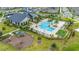 Aerial view showing a resort-style pool with a clubhouse and playground at 11648 Paragraph Rd, Orlando, FL 32832