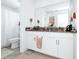 Bright bathroom boasts double sinks, a large mirror, and a shower/tub combo at 11648 Paragraph Rd, Orlando, FL 32832