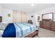 Comfortable bedroom with ensuite bathroom access and large bed at 11648 Paragraph Rd, Orlando, FL 32832