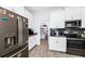 Modern kitchen with stainless steel appliances and walk-in pantry at 11648 Paragraph Rd, Orlando, FL 32832