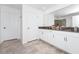 Modern bathroom with double vanity and a large mirror at 11648 Paragraph Rd, Orlando, FL 32832