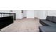 Spacious loft area with gray sectional sofa and TV at 11648 Paragraph Rd, Orlando, FL 32832