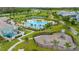 Aerial view of community pool with water features and playground at 11648 Paragraph Rd, Orlando, FL 32832