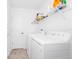 Convenient laundry room with washer, dryer, and shelving at 11648 Paragraph Rd, Orlando, FL 32832