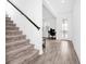 Modern staircase with carpet runner and tile flooring at 11648 Paragraph Rd, Orlando, FL 32832