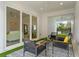 Relaxing back patio with seating area and view of the backyard at 1795 Walker Ave, Winter Park, FL 32789