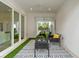 Outdoor patio furniture on a covered patio with artificial turf at 1795 Walker Ave, Winter Park, FL 32789