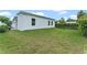 Large backyard with green grass and hedges at 1795 Walker Ave, Winter Park, FL 32789