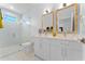Elegant bathroom with double vanity and a shower at 1795 Walker Ave, Winter Park, FL 32789