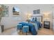 Bedroom with a bed, two ottomans, and nightstands at 1795 Walker Ave, Winter Park, FL 32789