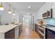 Modern kitchen with white and navy blue cabinets and stainless steel appliances at 1795 Walker Ave, Winter Park, FL 32789
