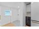 Bright laundry room with patterned tile floor and white cabinets at 1795 Walker Ave, Winter Park, FL 32789