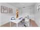 Home office with white desk and light wood flooring at 1795 Walker Ave, Winter Park, FL 32789