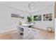 Bright office space with white desk, large windows and light flooring at 1795 Walker Ave, Winter Park, FL 32789