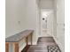 Light hallway featuring a console table and wood-look floors at 3286 Hanging Tide St, Winter Garden, FL 34787