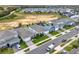 Aerial view showcasing a row of houses with gray roofs in a new Florida neighborhood at 3286 Hanging Tide St, Winter Garden, FL 34787