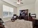 Home office with built-in desk and comfortable chair at 3286 Hanging Tide St, Winter Garden, FL 34787