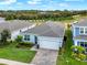 Single story house with gray roof, light blue exterior, and a landscaped front yard at 3286 Hanging Tide St, Winter Garden, FL 34787