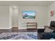 Spacious living room featuring comfortable seating and a large TV at 3286 Hanging Tide St, Winter Garden, FL 34787