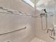 Clean shower with accessible features and neutral tile at 3286 Hanging Tide St, Winter Garden, FL 34787