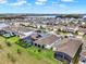 Aerial view of homes with pools and lush landscaping in a Florida community at 3286 Hanging Tide St, Winter Garden, FL 34787