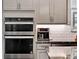 Modern kitchen boasts stainless steel appliances and granite counters at 3286 Hanging Tide St, Winter Garden, FL 34787