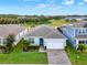 One-story home with gray roof, white garage door, and a neatly landscaped yard at 3286 Hanging Tide St, Winter Garden, FL 34787