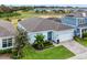 Single-story home with gray roof, light blue exterior, and a landscaped front yard at 3286 Hanging Tide St, Winter Garden, FL 34787
