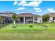 Spacious backyard with covered patio and lush green lawn at 3286 Hanging Tide St, Winter Garden, FL 34787