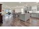 Spacious kitchen with granite island, stainless steel appliances, and light gray cabinets at 3286 Hanging Tide St, Winter Garden, FL 34787
