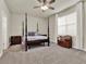 Spacious bedroom with a post bed, nightstands, and ample natural light at 3286 Hanging Tide St, Winter Garden, FL 34787