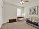 Cozy bedroom with sofa, desk and wall art at 3286 Hanging Tide St, Winter Garden, FL 34787