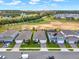 Aerial view of a new Florida community with several homes and a lake in the background at 3286 Hanging Tide St, Winter Garden, FL 34787