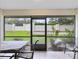 Relaxing screened patio overlooking a grassy backyard at 3336 Gray Fox Cv # 3336, Apopka, FL 32703