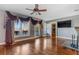 Spacious living room with hardwood floors, fireplace, and large windows at 4801 Beach Blvd, Orlando, FL 32803