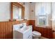 Small bathroom with wood paneling and water views at 4801 Beach Blvd, Orlando, FL 32803
