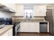 View of kitchen with stainless steel appliances and granite countertops at 4801 Beach Blvd, Orlando, FL 32803