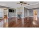 Living room with hardwood floors, fireplace, and access to other rooms at 4801 Beach Blvd, Orlando, FL 32803