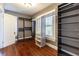 Bedroom with hardwood floors, built-in shelving, and a large closet at 4801 Beach Blvd, Orlando, FL 32803