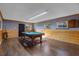 Game room with a pool table and wood-paneled walls at 4801 Beach Blvd, Orlando, FL 32803