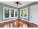 Spacious bedroom with hardwood floors and large windows at 4801 Beach Blvd, Orlando, FL 32803
