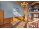 Sunlit living room with vaulted ceilings, hardwood floors, and expansive windows at 4801 Beach Blvd, Orlando, FL 32803